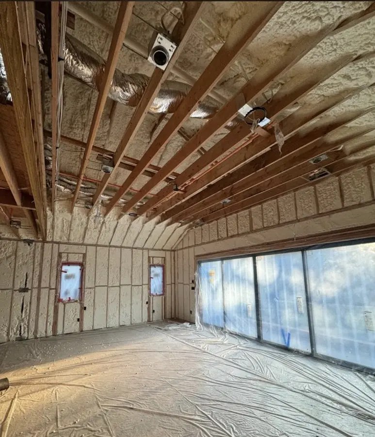 Interior walls and ceiling insulated with spray foam during new construction in Wolfeboro